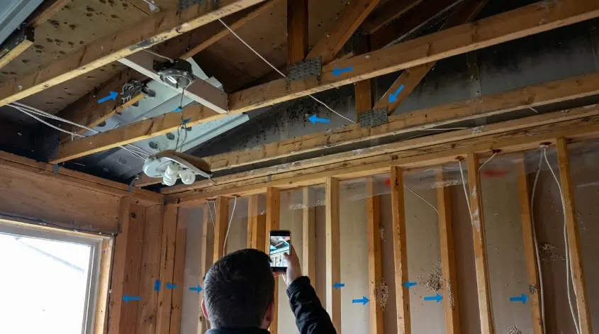 Homeowner shutting off main water valve during a water damage emergency