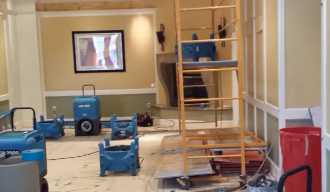 Technician performing a water damage inspection and assessment