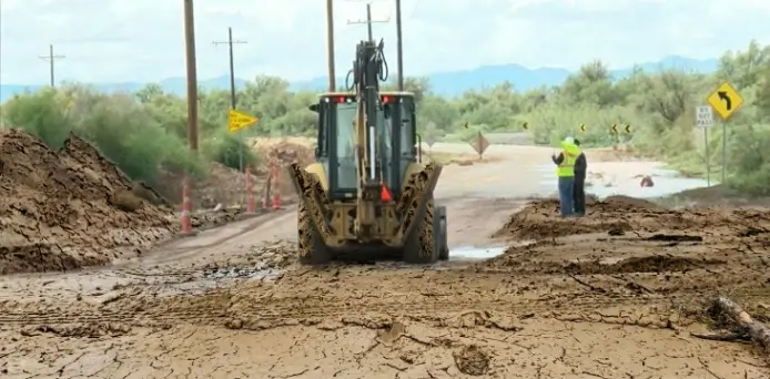 Homeowner documenting flood damage with photos for an insurance claim